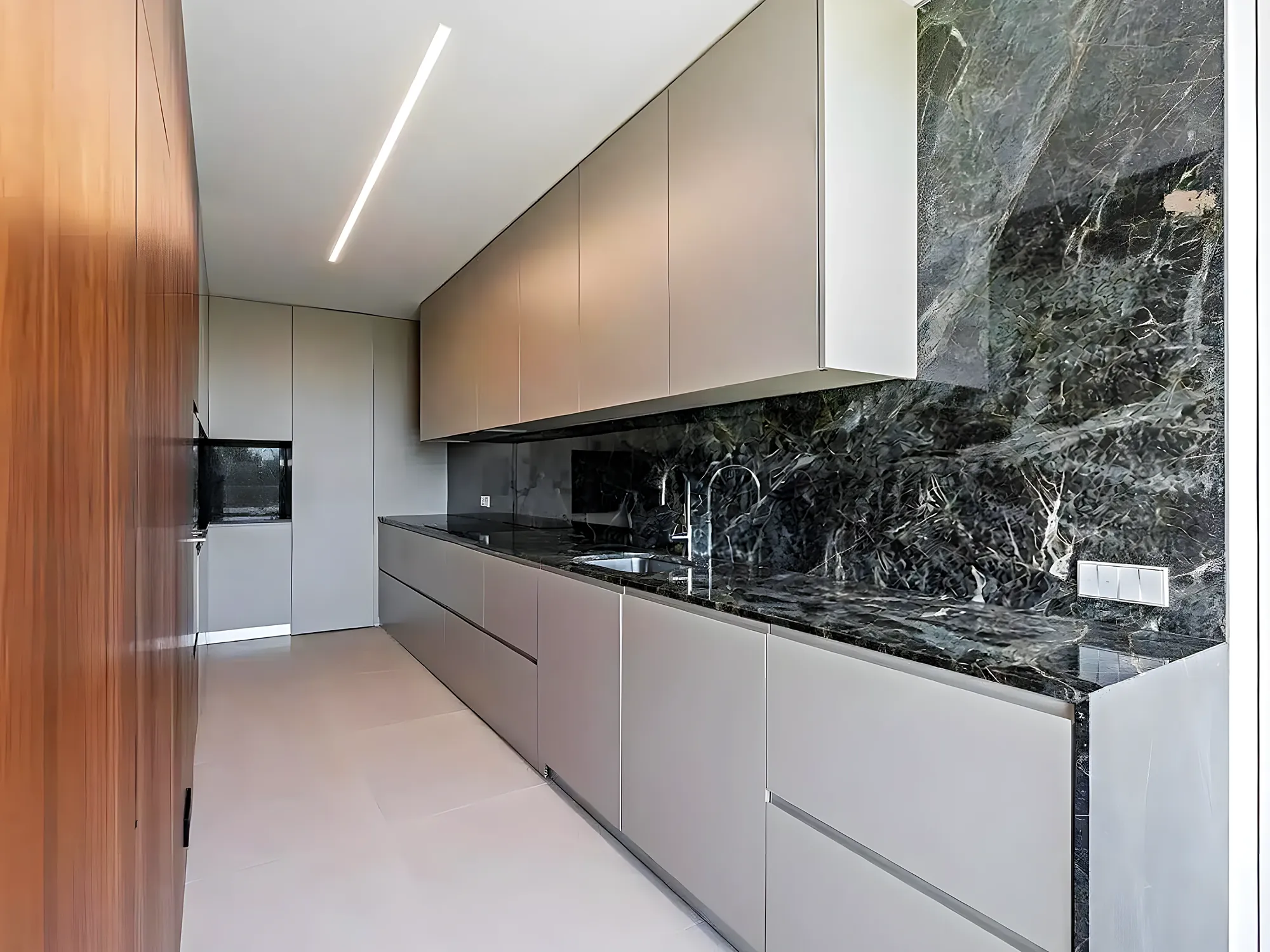 White kitchen with green marble worktop — kitchen renovation in Fuengirola