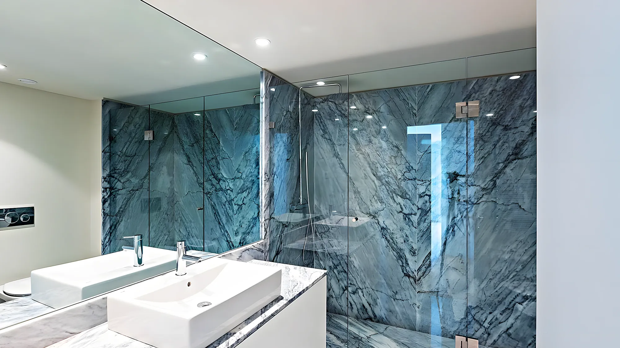 Dark marble bathroom with glass screen — renovation in Fuengirola